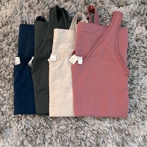 Buttery, stretchy tanks from Anthropologie! Slight v-neck / reversible to scoop.